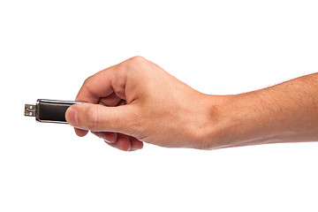 Image showing Closeup image: hand holding black USB data storage or connecting