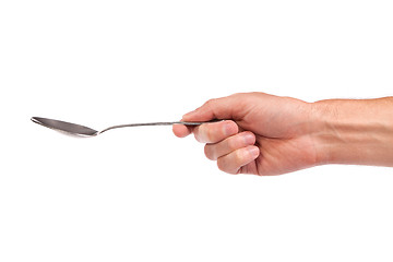 Image showing Hand is holding a spoon isolated