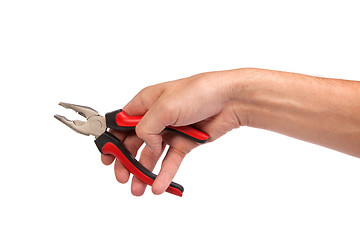 Image showing Male hand hold a black and red pliers