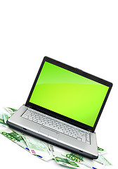 Image showing Open laptop with money