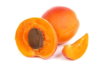 Image showing Two ripe apricot sectioned by knife