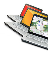 Image showing Open laptops with money