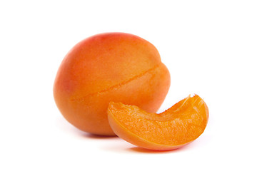 Image showing Two ripe apricot sectioned by knife