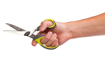 Image showing Hand is holding scissors isolated