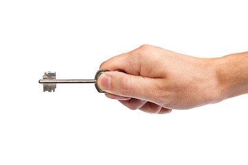 Image showing Male hand holding a key to the house