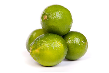 Image showing Group of whole limes  and one half lime on white