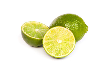 Image showing One whole lime and one half lime on white