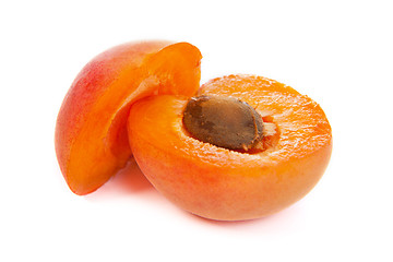 Image showing Two ripe apricot sectioned by knife