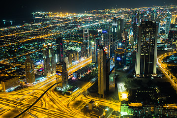 Image showing Dubai downtown night scene with city lights,