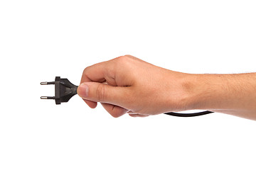 Image showing Man is holding a black outlet in the hand