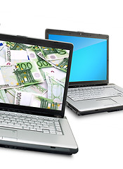 Image showing Open laptops with money