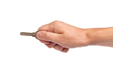 Image showing Male hand holding a key to the house