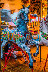 Image showing Carousel. Horses on a carnival Merry Go Round.