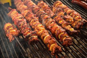 Image showing Steak and other meat on barbeque. Background. Smoke. Meals, Clos