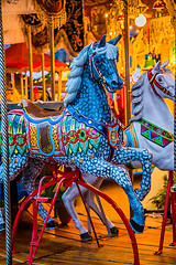 Image showing Carousel. Horses on a carnival Merry Go Round.