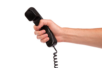 Image showing Hand holding an old black telephone tube