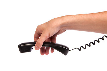 Image showing Hand holding an old black telephone tube