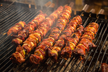 Image showing Steak and other meat on barbeque. Background. Smoke. Meals, Clos