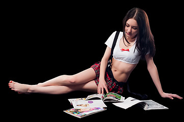 Image showing Attractive woman reading magazines