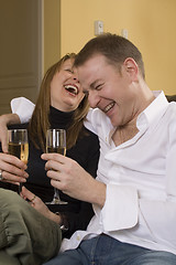 Image showing couple sitting on black couch