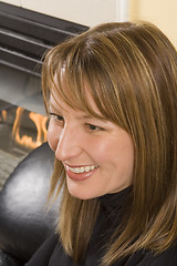 Image showing woman sitting on couch