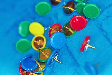 Image showing Wet pushpins on a blur background