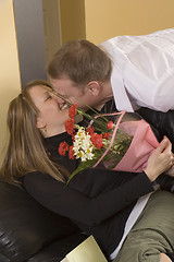 Image showing man offering a bouquet to a woman