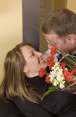 Image showing man offering a bouquet to a woman