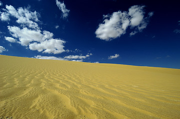 Image showing Sand dune with clouds in the Wadi Rayan