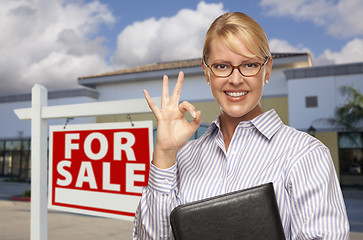 Image showing Businesswoman In Front of Office Building and For Sale Sign