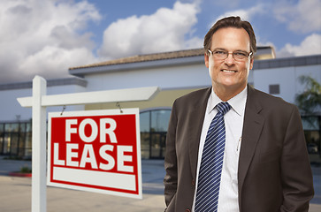 Image showing Businessman In Front of Office Building and For Lease Sign