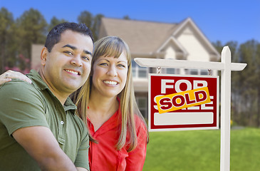 Image showing Couple in Front of Sold Real Estate Sign and House