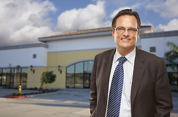 Image showing Businessman In Front of Vacant Office Building.