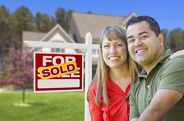 Image showing Couple in Front of Sold Real Estate Sign and House