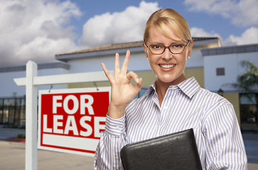 Image showing Businesswoman In Front of Office Building and For Lease Sign