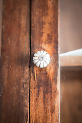 Image showing Closeup of old fashioned door knob on wooden door