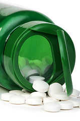 Image showing White pills and a container