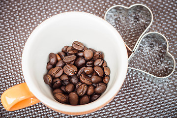 Image showing Mug cup of coffee grain on a grunge background