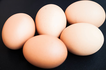 Image showing Organic chicken eggs in a black tray