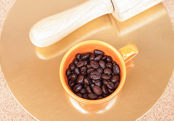 Image showing Roasted coffee beans in a cup on the table 