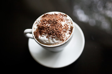 Image showing Cappuccino in white cup with chocolate sprinkles