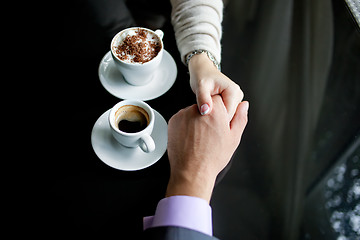 Image showing Concept of male and female hands, love and coffee