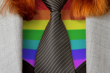 Image showing Caucasian business woman with a tie, rainbow flag pattern