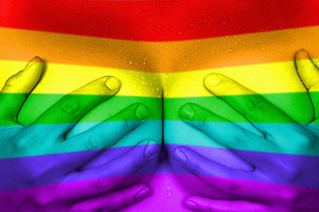 Image showing Hands covering breasts, rainbow flag