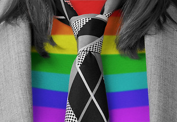 Image showing Caucasian business woman with a tie, rainbow flag pattern