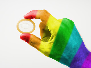 Image showing Male giving a condom, rainbow flag pattern