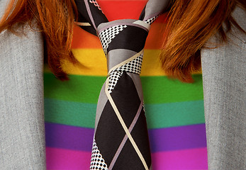 Image showing Caucasian business woman with a tie, rainbow flag pattern