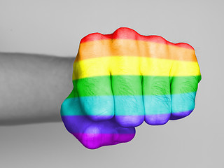 Image showing Fist of a man punching, rainbow flag pattern