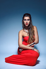 Image showing Beautiful fashion young woman in red dress