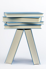 Image showing A stack of some closed blue books 